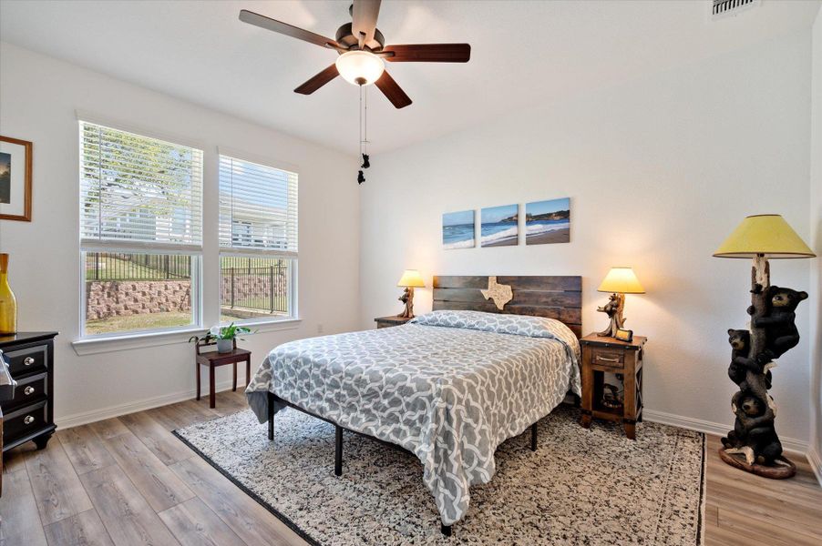 Primary Bedroom with light wood finished floors and ceiling fan Primary Bedroom with light wood finished floors and ceiling fan