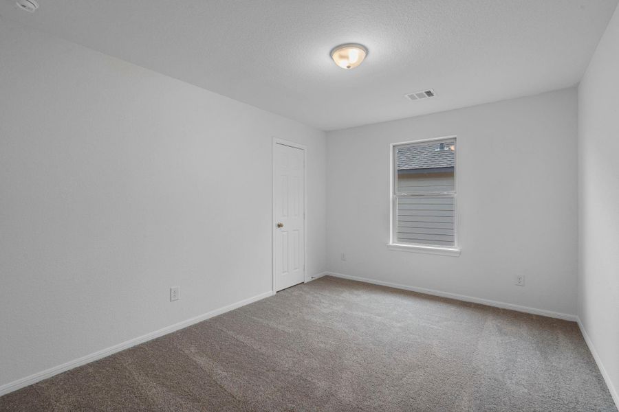 Your secondary bedroom features plush carpet, fresh paint, closet, and a large window that lets in plenty of natural lighting. Your secondary bedroom features plush carpet, fresh paint, closet, and a large window that lets in plenty of natural lighting.