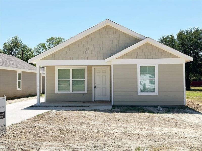 Front exterior of a new home in , Mineral Wells, TX, highlighting curb appeal (Image 12). Front exterior of a new home in , Mineral Wells, TX, highlighting curb appeal (Image 12).