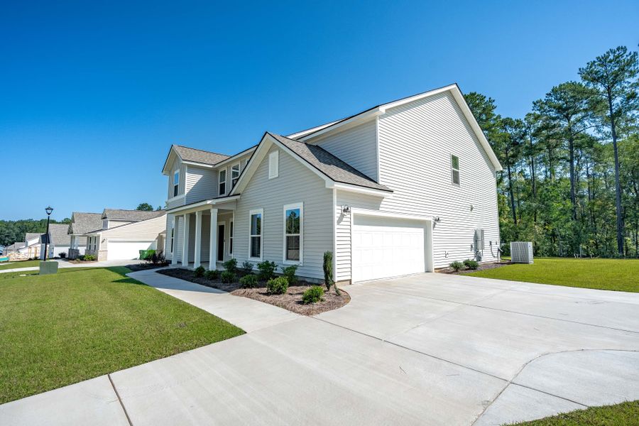Front exterior of a new home in Oakleaf Chase, Blythewood, SC, highlighting curb appeal (Image 19).