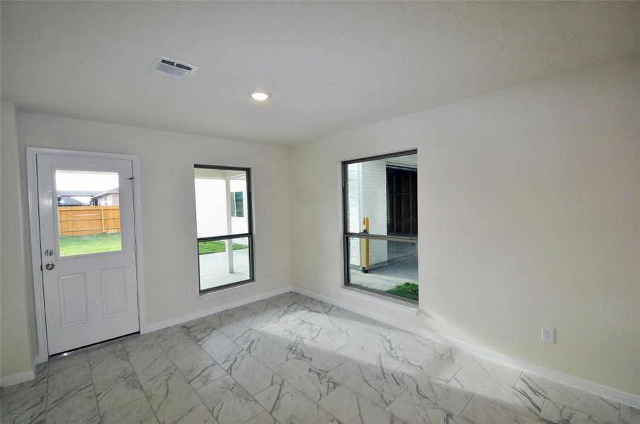 Rear door to the covered patio and breezeway to the garage.