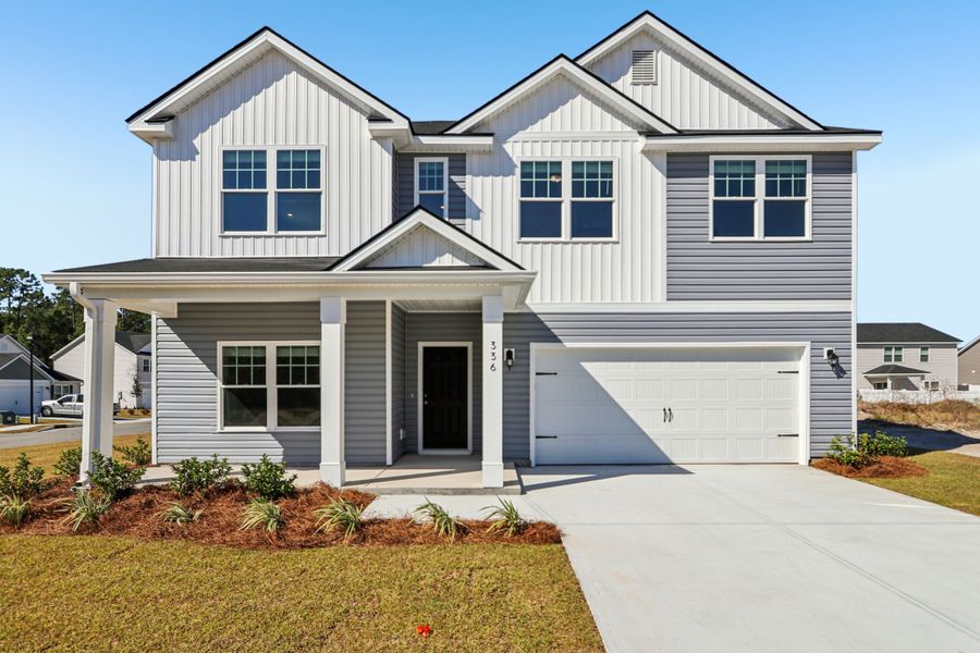 Front exterior of a new home in Hayden Pointe, St. Marys, GA, highlighting curb appeal (Image 2). Front exterior of a new home in Hayden Pointe, St. Marys, GA, highlighting curb appeal (Image 2).