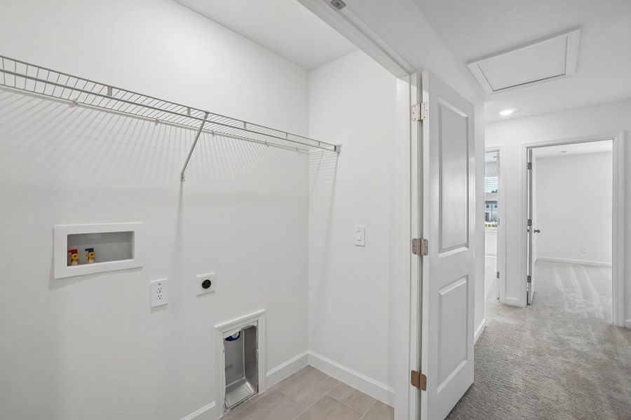 Laundry closet located off the hallway Laundry closet located off the hallway