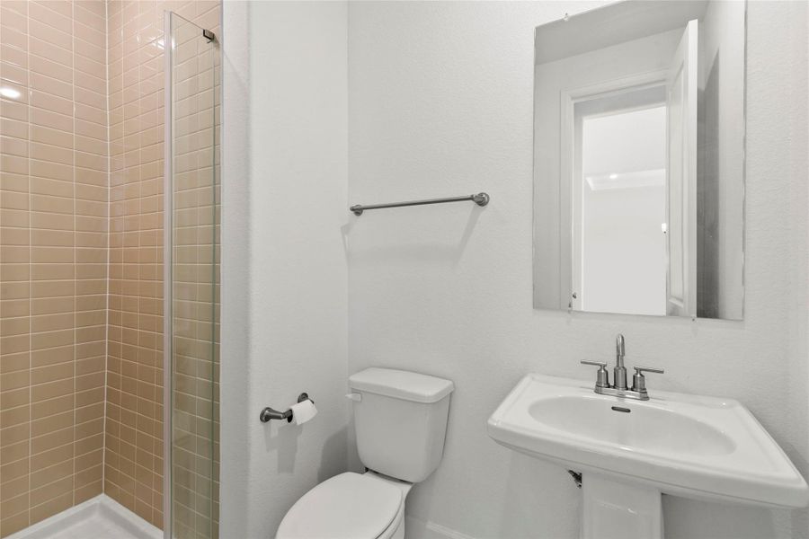 Stylish first-floor full bath for added convenience.