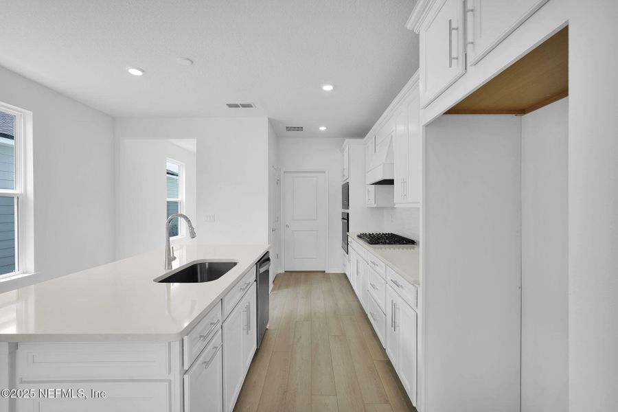 Furnished interior view inside a new home in Summer Bay at Grand Oaks, St. Augustine (Image 9).