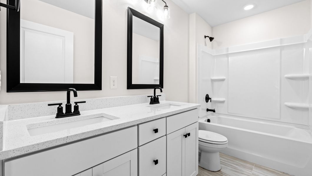 Representative furnished interior of a home built from the VERWOOD by D.R. Horton in Adams Glen, Greenville (Image 12).