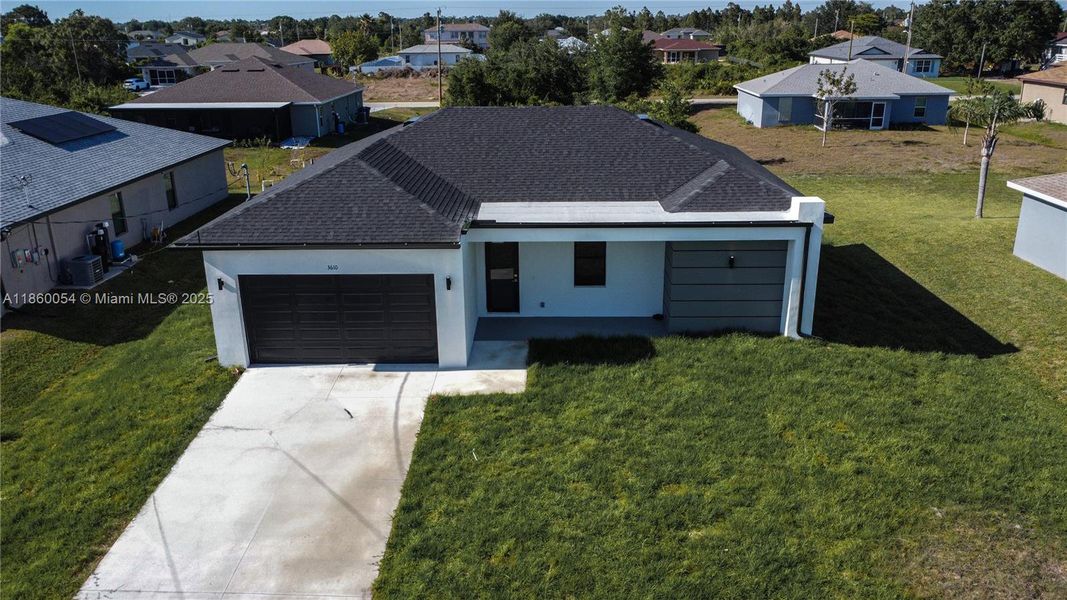 Front exterior of a new home in , Lehigh Acres, FL, highlighting curb appeal (Image 23).