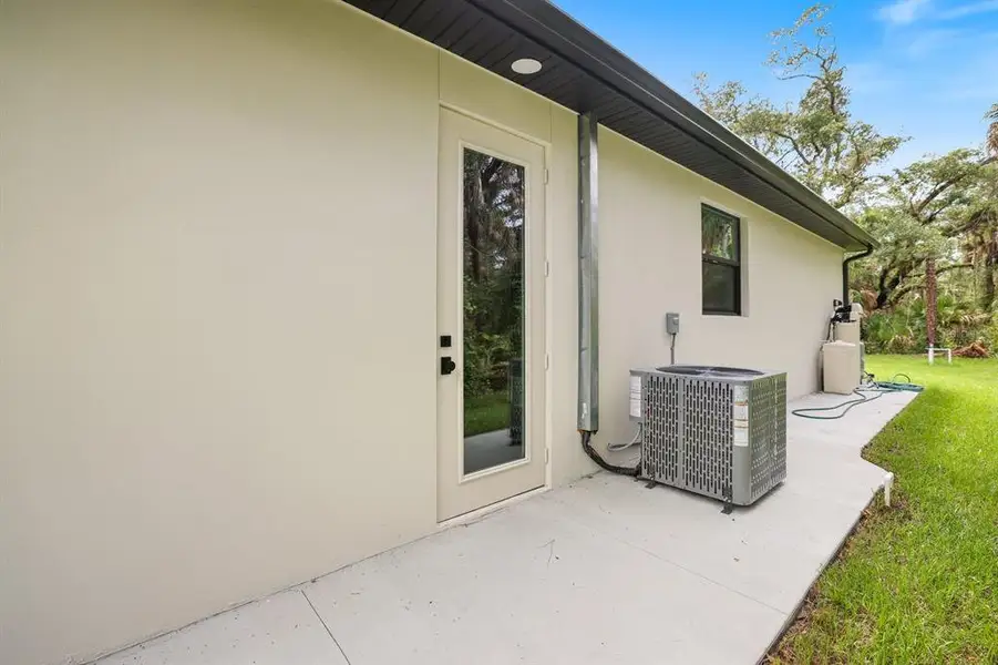 Exterior details and patio area of a home in , Port Charlotte (Image 26).