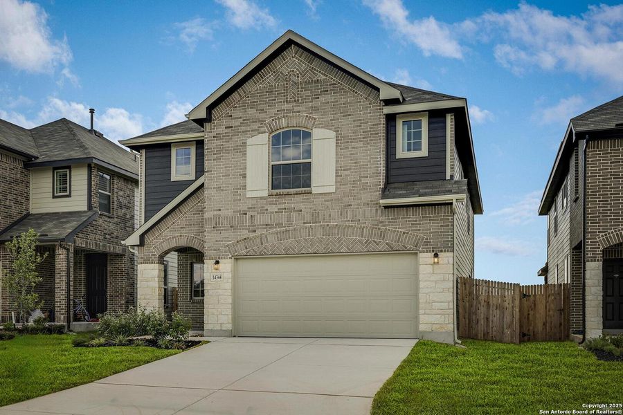Front exterior of a new home in Morgan Meadows, San Antonio, TX, highlighting curb appeal (Image 2). Front exterior of a new home in Morgan Meadows, San Antonio, TX, highlighting curb appeal (Image 2).