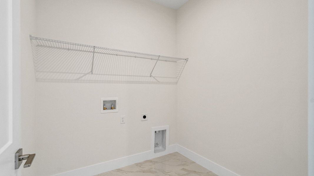 The Sweetgum Spacious Laundry Room in two story home in Trailside in Mount Dora by DRB Homes