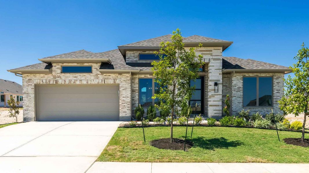 Front exterior of a new home in Nolina, Georgetown, TX, highlighting curb appeal (Image 2). Front exterior of a new home in Nolina, Georgetown, TX, highlighting curb appeal (Image 2).