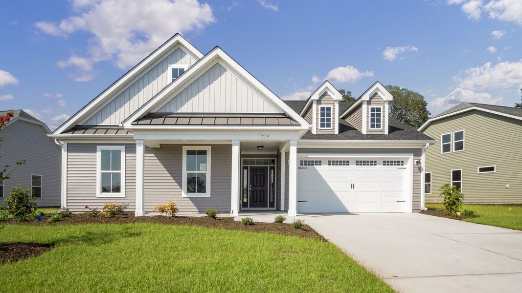 Front exterior of a home in the Bridgewater - Shorehaven Village community, located in Little River, SC (Image 4).