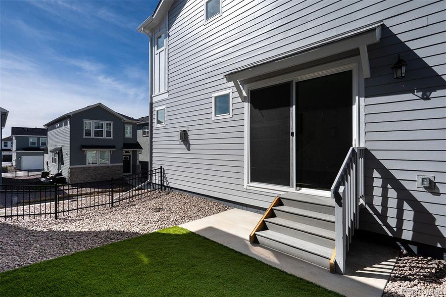 Exterior details and patio area of a home in Revel Crossing at Wolf Ranch – The Ascent Collection, Colorado Springs (Image 21).