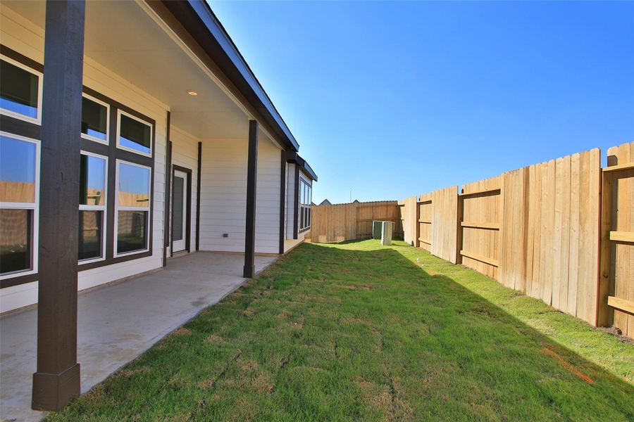 Exterior details and patio area of a home in Oakwood Estates, Waller (Image 3).