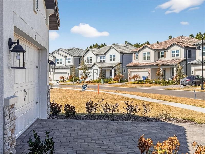 Exterior details and patio area of a home in Shortgrass at Two Rivers, Zephyrhills (Image 3).