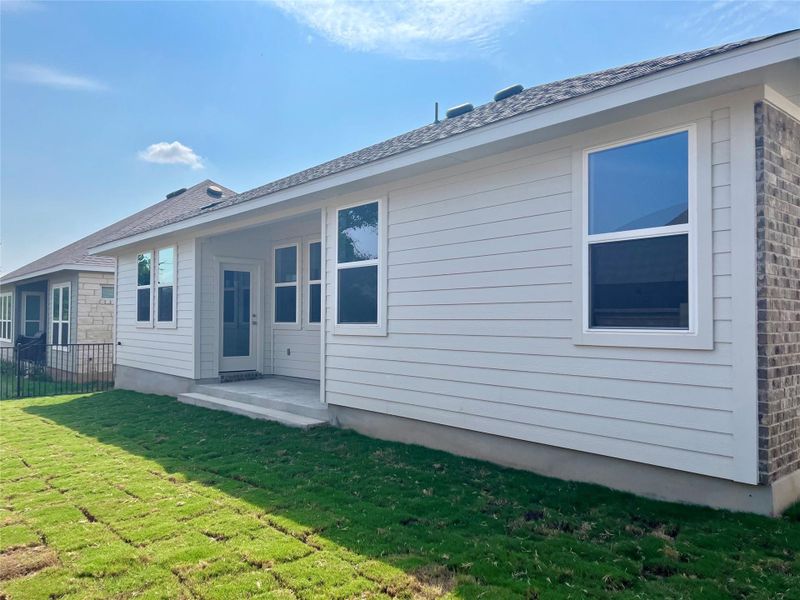 Front exterior of a new home in Anthem Cottages, Kyle, TX, highlighting curb appeal (Image 1).
