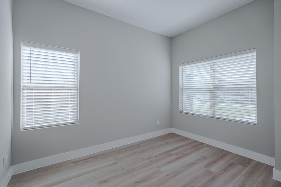 Secondary bedroom with ample space and walk-in closet