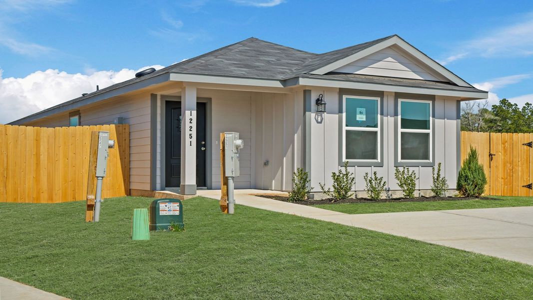 Front exterior of a new home in Castles Edge, Willis, TX, highlighting curb appeal (Image 13).