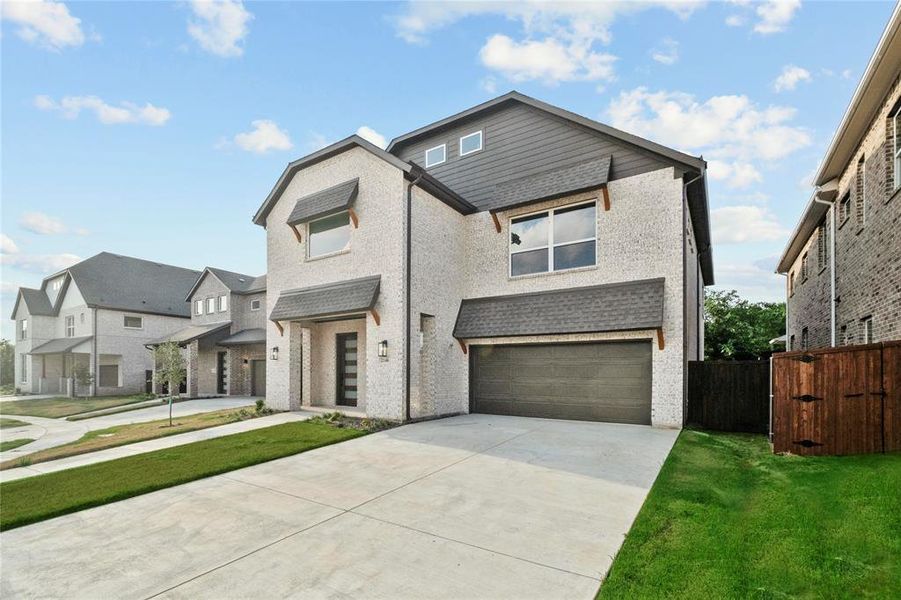 View of front of house with an attached garage, concrete driveway, a residential view, and brick siding View of front of house with an attached garage, concrete driveway, a residential view, and brick siding