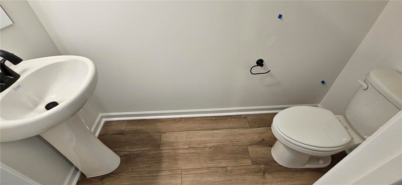 This bathroom features a contemporary pedestal sin
