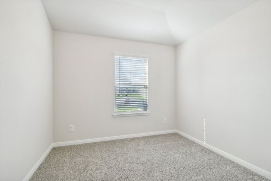 Guest bedroom in the Briscoe floorplan at a Meritage Homes community.