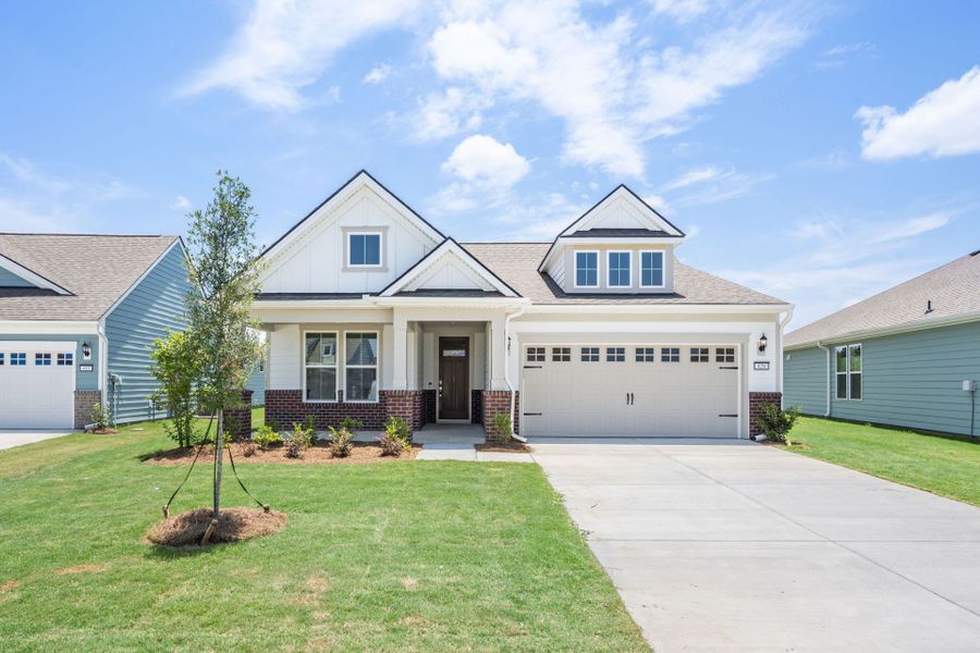 Front exterior of a new home in Del Webb Savannah at Heartwood, Richmond Hill, GA, highlighting curb appeal (Image 1). Front exterior of a new home in Del Webb Savannah at Heartwood, Richmond Hill, GA, highlighting curb appeal (Image 1).