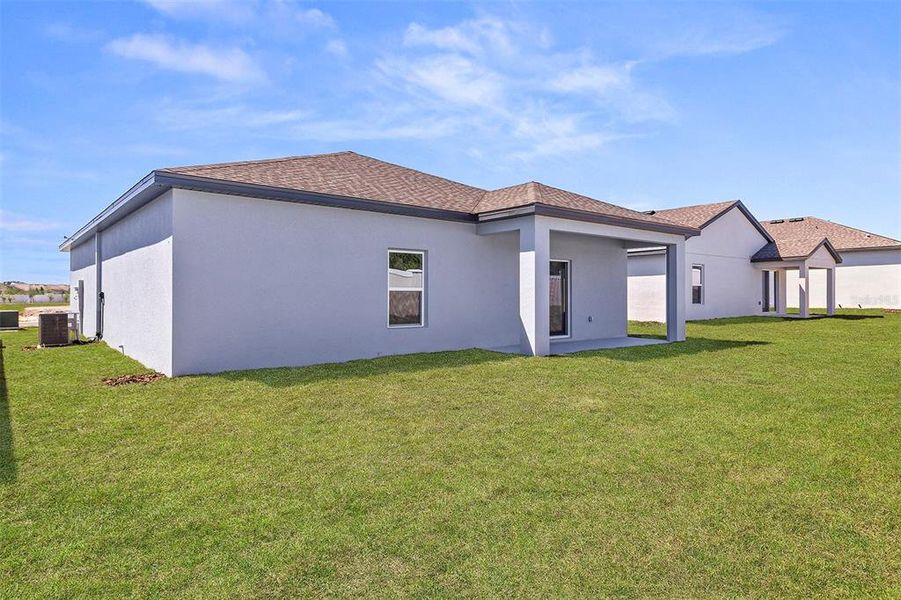 Exterior details and patio area of a home in Peach Crossings, Winter Haven (Image 3). Exterior details and patio area of a home in Peach Crossings, Winter Haven (Image 3).