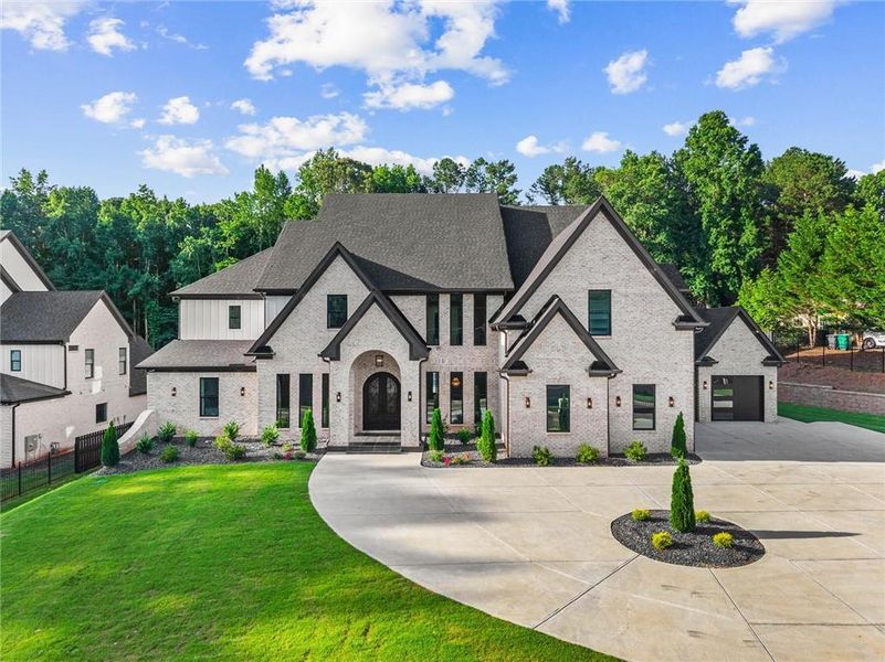 Front exterior of a new home in , Lawrenceville, GA, highlighting curb appeal (Image 1). Front exterior of a new home in , Lawrenceville, GA, highlighting curb appeal (Image 1).