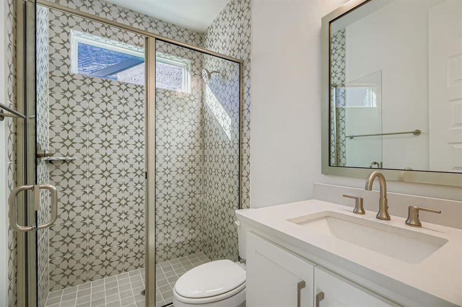 Bathroom with vanity and a shower stall
