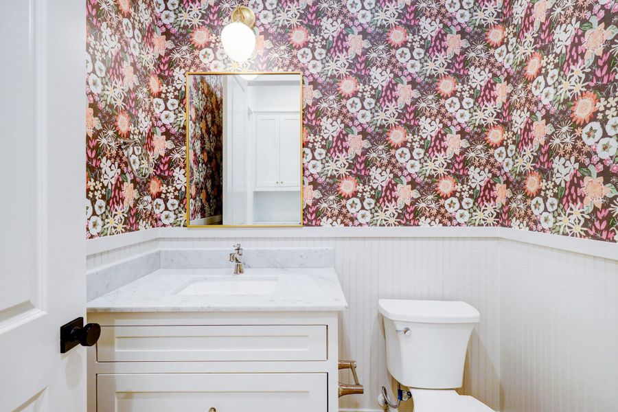 Powder room on the first floor with designer wallpaper and finishes. *Previous Project*
