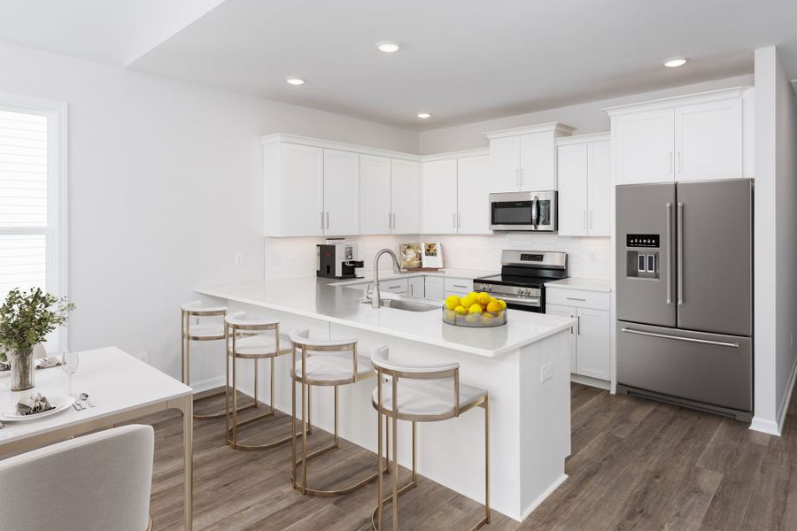 Representative furnished interior of a home built from the Palm by Stevens Fine Homes in River Hills, Shallotte (Image 8).