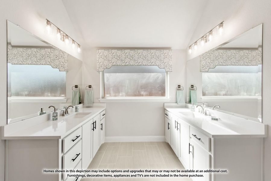Bathroom with dual vanities, white cabinets, large mirrors, and light tile floors