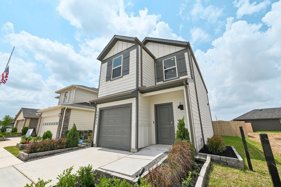 Front exterior of a new home in Legacy Park, Houston, TX, highlighting curb appeal (Image 1).