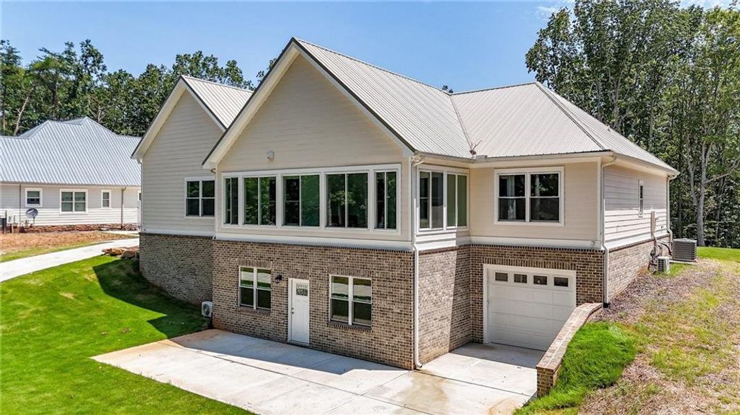 Front exterior of a new home in , Canton, GA, highlighting curb appeal (Image 38).