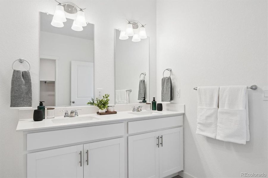 Primary bathroom with dual sinks. Primary bathroom with dual sinks.