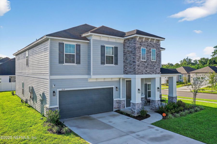 Front exterior of a new home in , Middleburg, FL, highlighting curb appeal (Image 23).