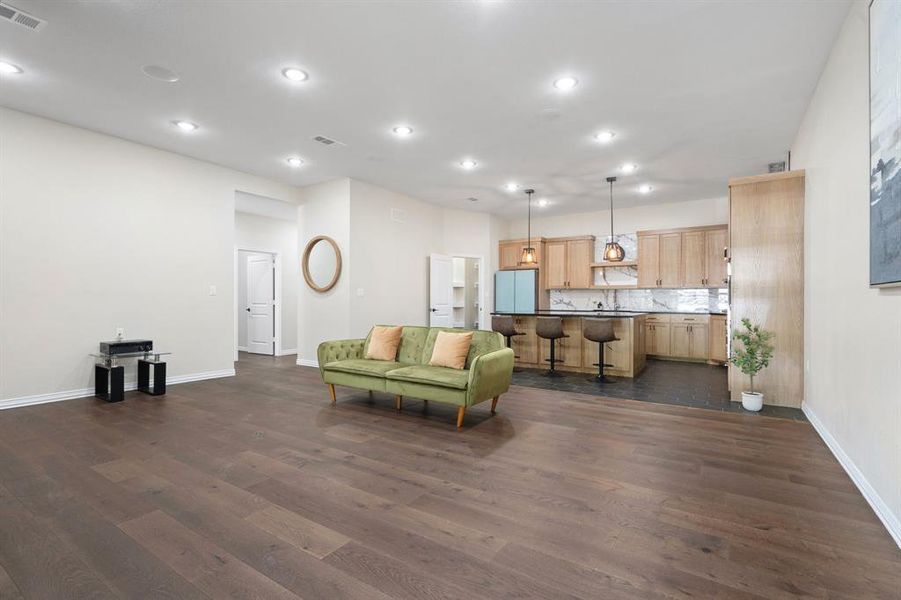 Living area featuring recessed lighting and dark wood-type flooring Living area featuring recessed lighting and dark wood-type flooring