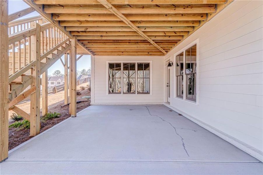 Exterior details and patio area of a home in Malone's Pond, Ball Ground (Image 27).