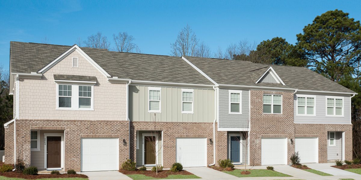 Front exterior of a new home in Greyson Parc, Heron Bay, GA, highlighting curb appeal (Image 1). Front exterior of a new home in Greyson Parc, Heron Bay, GA, highlighting curb appeal (Image 1).