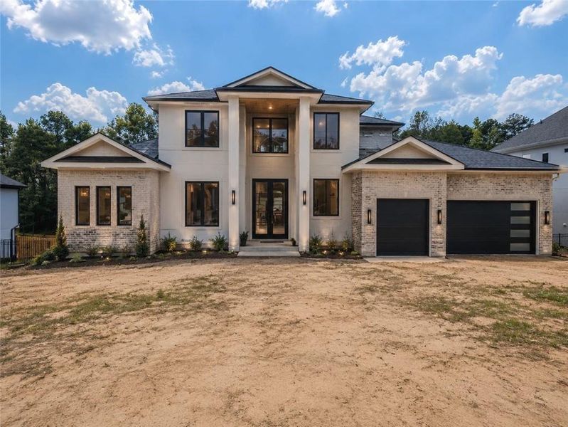 Front exterior of a new home in , Flowery Branch, GA, highlighting curb appeal (Image 1). Front exterior of a new home in , Flowery Branch, GA, highlighting curb appeal (Image 1).
