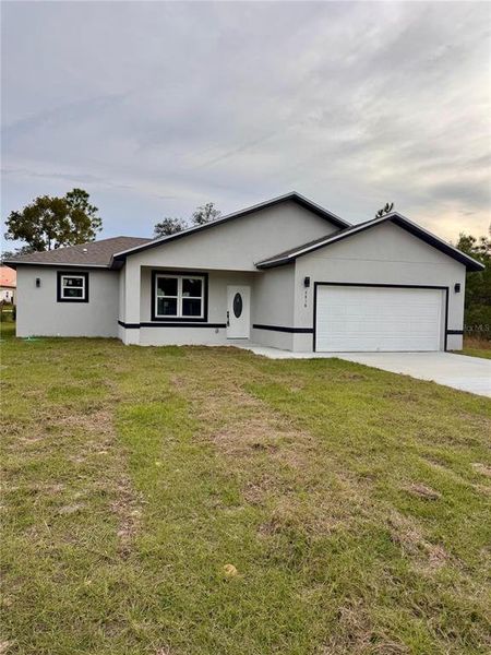 Front exterior of a new home in , Dunnellon, FL, highlighting curb appeal (Image 24).