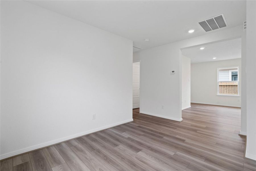 Additional view from Den looking to hallway on left leading to the secondary bedrooms and bathroom.