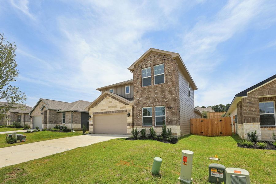 Front exterior of a new home in Pine Lake Cove - Premier Series, Montgomery, TX, highlighting curb appeal (Image 1).