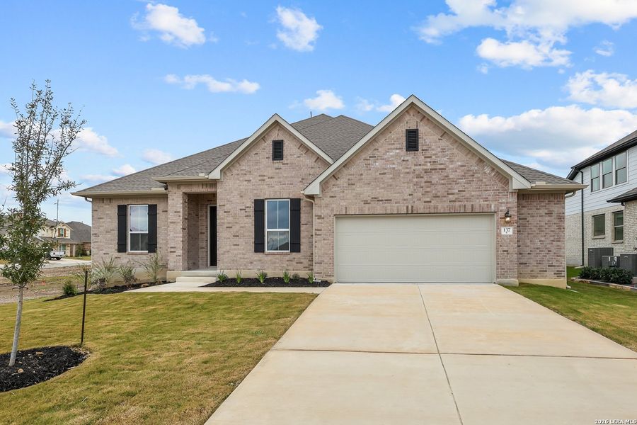 Front exterior of a new home in Buffalo Crossing, Cibolo, TX, highlighting curb appeal (Image 23).