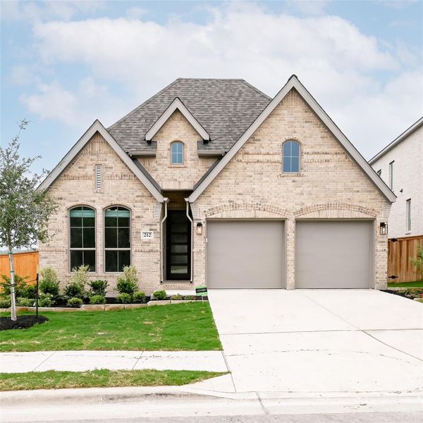 Front exterior of a new home in 6 Creeks, Kyle, TX, highlighting curb appeal (Image 21).
