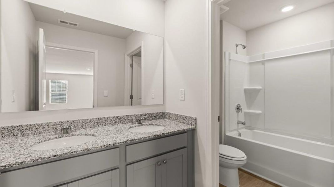 Furnished interior view inside a new home in Northwoods at Mirror Lake, Villa Rica (Image 9).