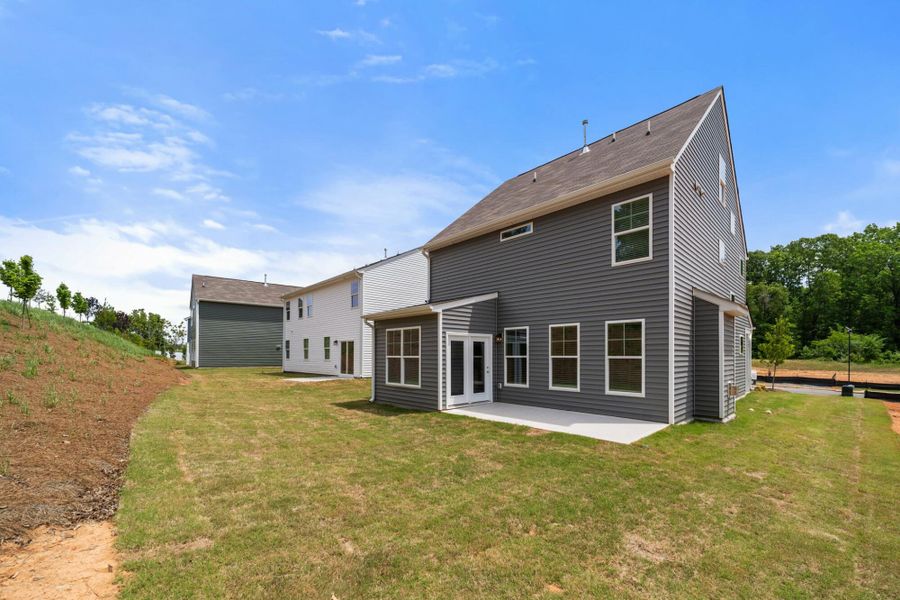 Front exterior of a new home in Chandler Ridge, McLeansville, NC, highlighting curb appeal (Image 21).