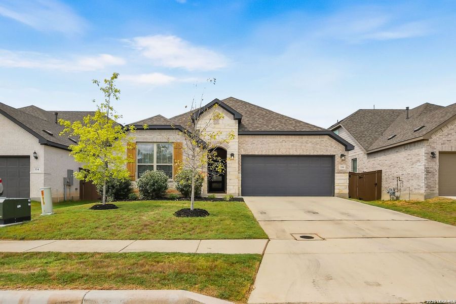 Front exterior of a new home in Corley Farms, Boerne, TX, highlighting curb appeal (Image 25). Front exterior of a new home in Corley Farms, Boerne, TX, highlighting curb appeal (Image 25).