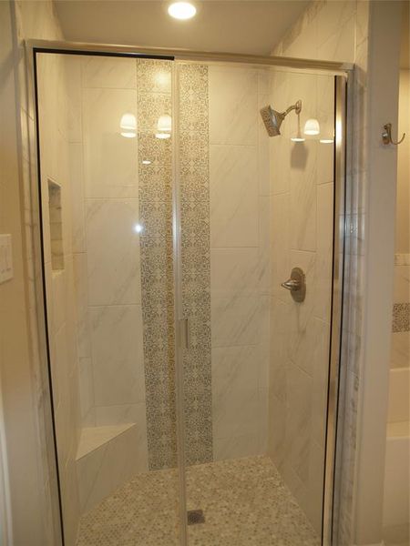 Bathroom with an enclosed shower