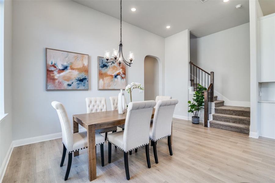 Dining room featuring a chandelier and light hardwood / wood-style flooring